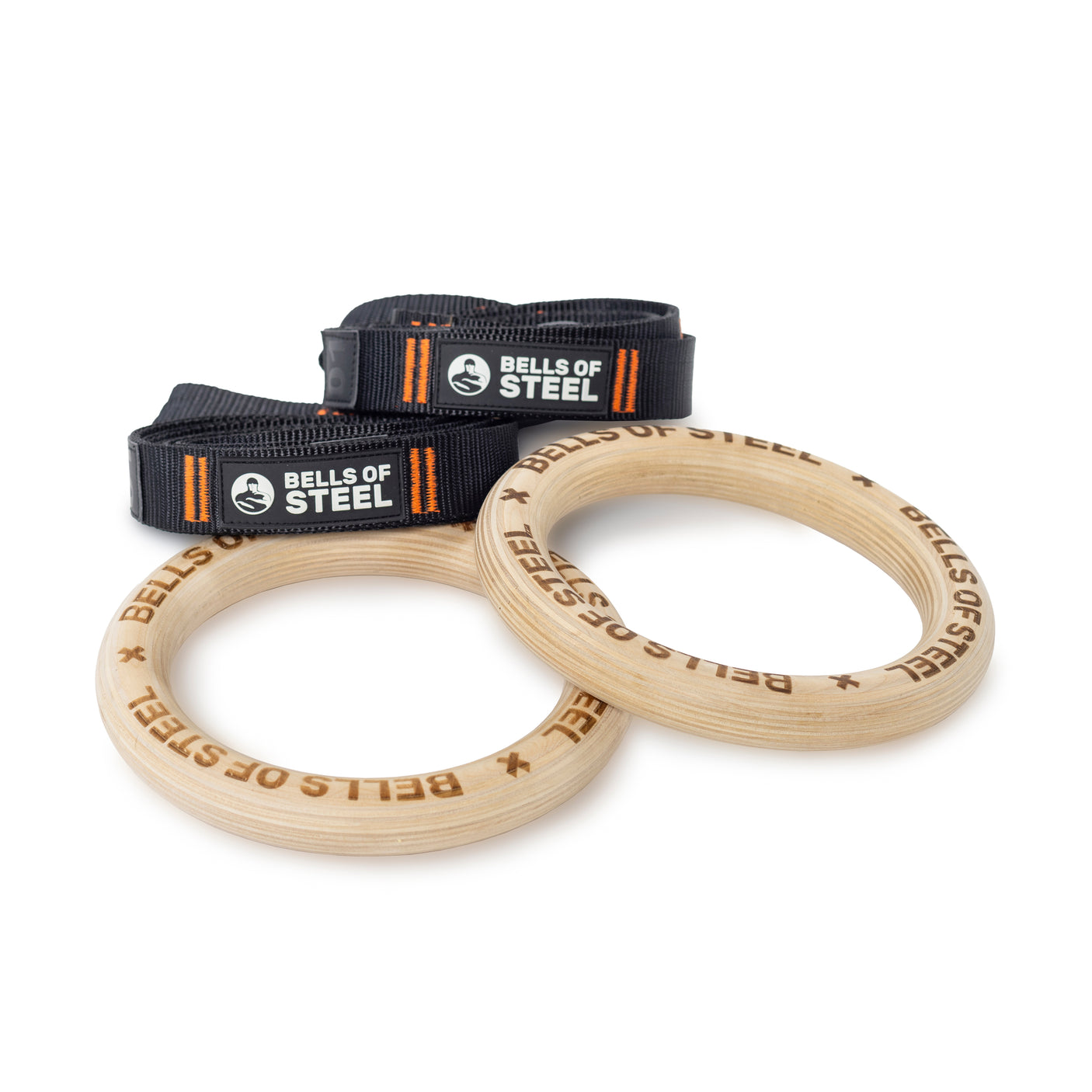 Bells of Steel's wooden Gymnastics Rings, featuring engraved branding, come with adjustable black nylon straps with orange stitching and logo patches—perfect for bodyweight training and portable fitness.