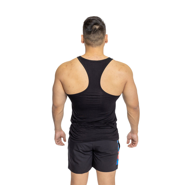 A muscular man models the Bells of Steel Bamboo Tank Top and black shorts, standing with his back to the camera against a white background.