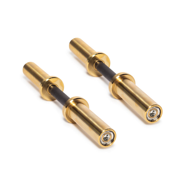 The Bells of Steel Loadable Dumbbell Handle features gold-colored metal with black grips, smooth polished finishes, and visible end bearings—ideal for any home gym. Shown on a white background.