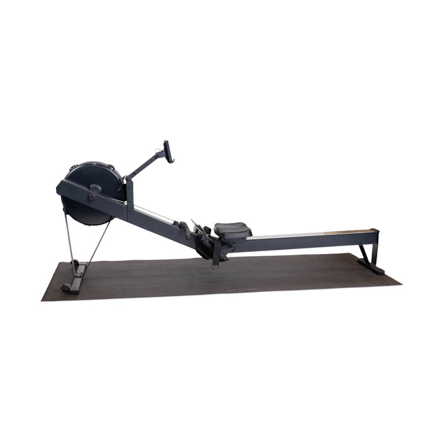 A black Bells of Steel Cardio Machine Floor Mat supports a rowing machine, both displayed on a plain white background.