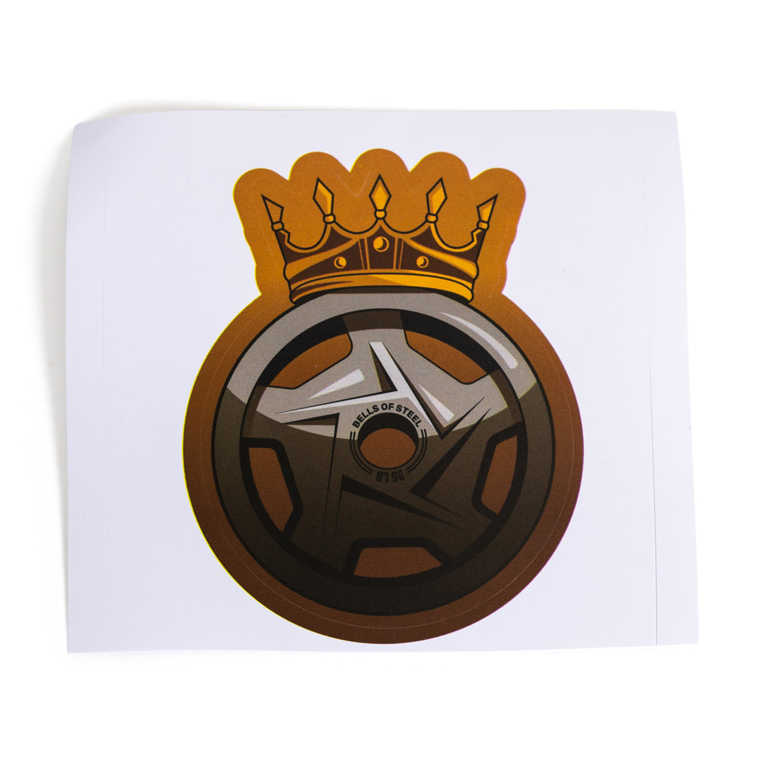 The Bells of Steel Stickers feature a die-cut car wheel with five spokes, "Wheels of Steel" text, and a gold crown on a white background—ideal for anyone wanting durable stickers with bold style.