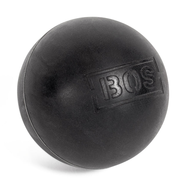A solid black Bells of Steel Massage Ball, featuring "BOS" embossed on one side, designed for targeted muscle massage, is displayed against a white background.