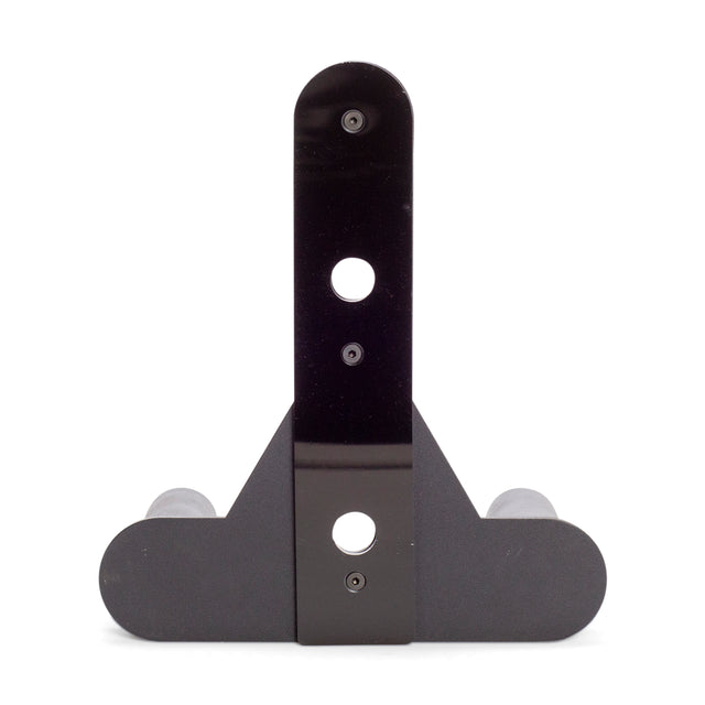 Front view of Bells of Steel Change Plate Storage Pegs in black metal, featuring a vertical plate with three holes and a rounded horizontal base—ideal for wall mounting or storing Olympic change plates on your power rack.