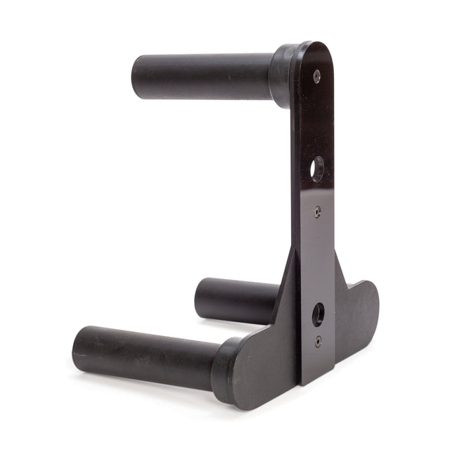 The Bells of Steel Change Plate Storage Pegs are black metal wall-mounted holders with two parallel padded arms, designed to securely support Olympic change plates horizontally, similar to a guitar hanger for instruments.