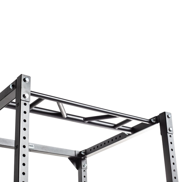 A close-up of the Bells of Steel Light Commercial Power Rack (2.3" x 2.3", ⅝" HOLES) shows its multi-grip metal pull-up bar with bolt fastenings—perfect for home use—set against a white background.