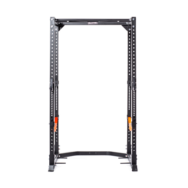 The Bells of Steel Light Commercial Power Rack (2.3" x 2.3", ⅝" holes) is a black metal home training unit with multiple adjustable attachment points and two orange safety pins on each side for added barbell protection.