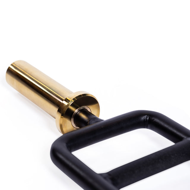 A close-up of the Bells of Steel Tricep Bar shows its shiny gold metal sleeve and ergonomic black rectangular handles, set against a white background.