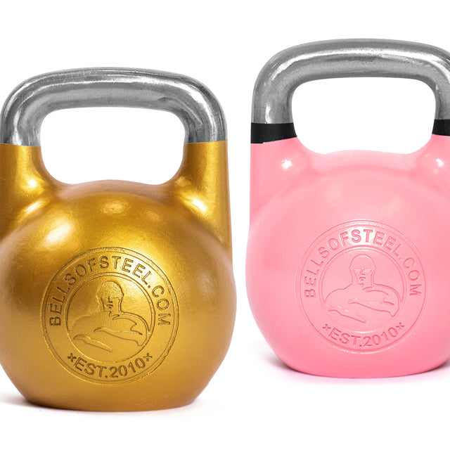 Two Bells of Steel Competition Kettlebells, one gold and one pink, featuring ergonomic design and metal handles with brand logos, are displayed side by side on a white background.