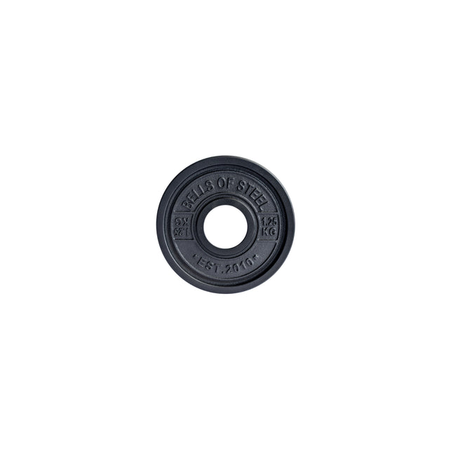 A black Bells of Steel Calibrated Powerlifting Plate, designed to IPF specifications, features a center hole with "BELLS OF STEEL" on top, "1.25 KG" on the right, and "EST. 2010" below.