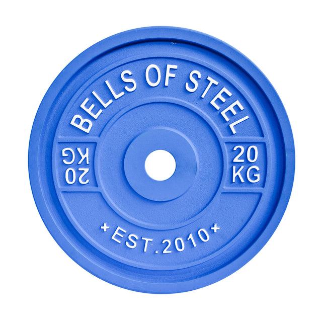 A blue Bells of Steel weight plate, marked "20 KG" and "EST. 2010," crafted to IPF specs for precision training, features a smooth, rounded design with standardized diameters.