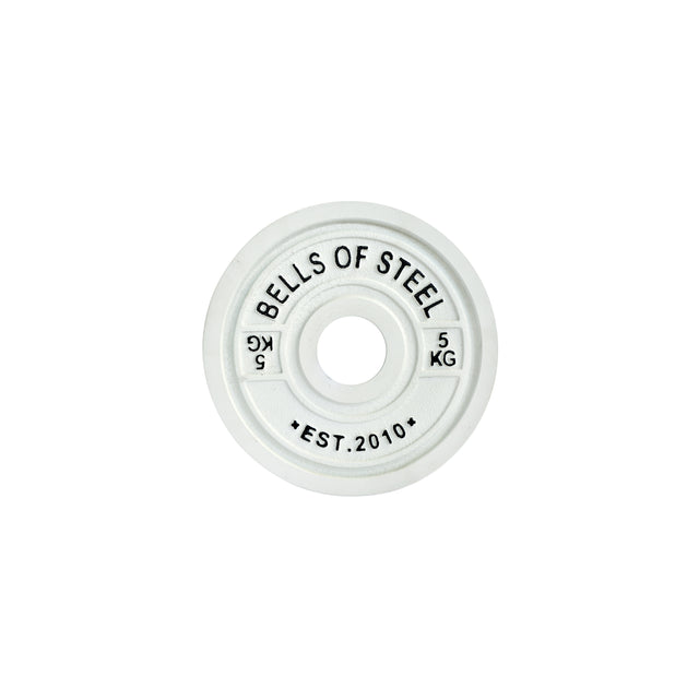 A Bells of Steel white Calibrated Powerlifting Plate displays "BELLS OF STEEL" and "5 KG" in black, meeting IPF specifications. The plate includes "EST. 2010" at the bottom, with a center hole for barbells, perfect for powerlifting.