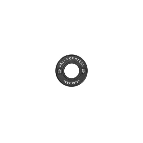 A single black "Bells of Steel" 5 LB calibrated powerlifting plate, part of the collection established in 2010, rests against a plain white background, highlighting its durability and precision.