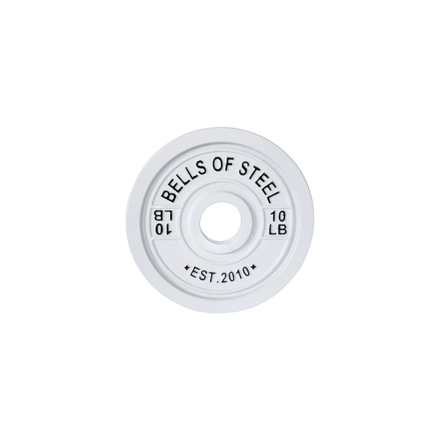 A white 10 LB training plate from Bells of Steel features "BELLS OF STEEL" at the top and "EST. 2010" at the bottom. It's part of a color-coded system with a central hole for a barbell, ideal for calibrated powerlifting sessions.