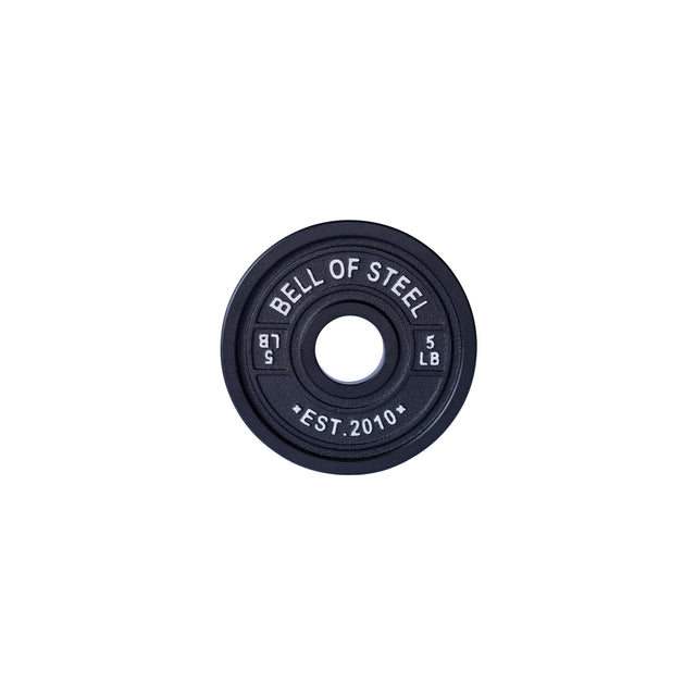 A black Calibrated Powerlifting Plate by Bells of Steel features color-coding, "5 LB," "EST. 2010," and "51.5." It has a central hole for easy barbell mounting, perfect for precise training sessions.