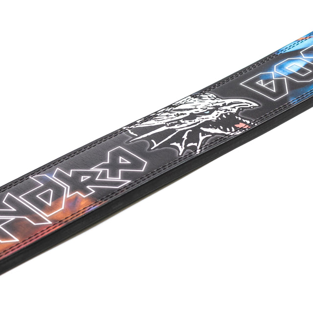 A close-up of the Bells of Steel Lever Belt in black, showcasing a white dragon head and bold graffiti-style text with blue and orange highlights—ideal for powerlifting.