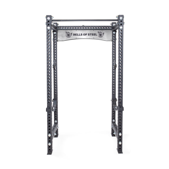 The Bells of Steel Manticore Four Post Power Rack Builder features 3"x3" uprights, 1" holes, a pull-up bar, and branded top panel—ideal for weightlifting and strength training in your home gym.