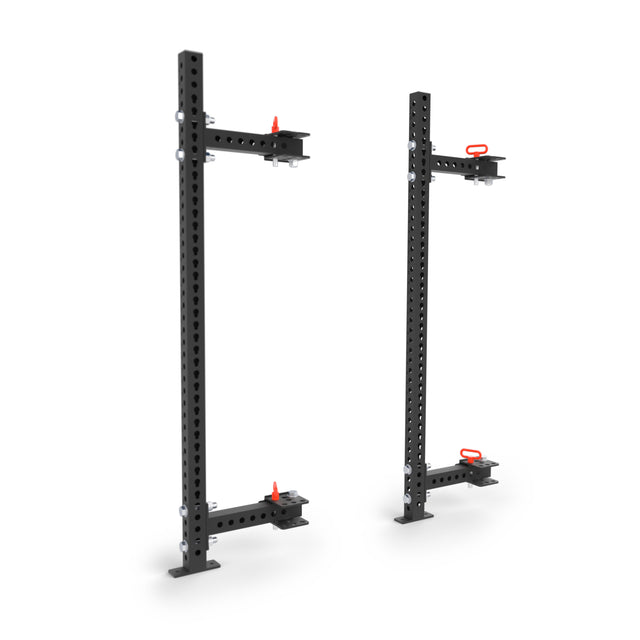 The Bells of Steel Manticore Folding Half Rack (3" x 3", 1" holes) features black metal vertical racks, sturdy base plates, and red-handle adjustable attachments—perfect modular gym equipment for your home gym.