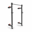 The Bells of Steel Manticore Folding Half Rack (3"x3", 1" holes) is a black metal rack with adjustable safety arms, J-hooks, and a pull-up bar—perfect modular gym equipment for any home gym.