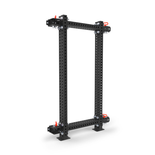 The Bells of Steel Manticore Folding Power Rack - Prebuilt (3"x3", 1" Holes) features a black metal frame with multiple holes and red locking handles—perfect for home gyms or folding rack systems.