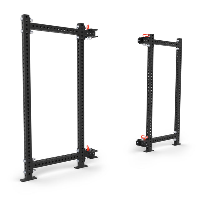 Two black Bells of Steel Manticore Folding Power Racks (3" x 3", 1" holes) with red safety pins stand on a white background. The left, larger rack is ideal for any home gym setup.