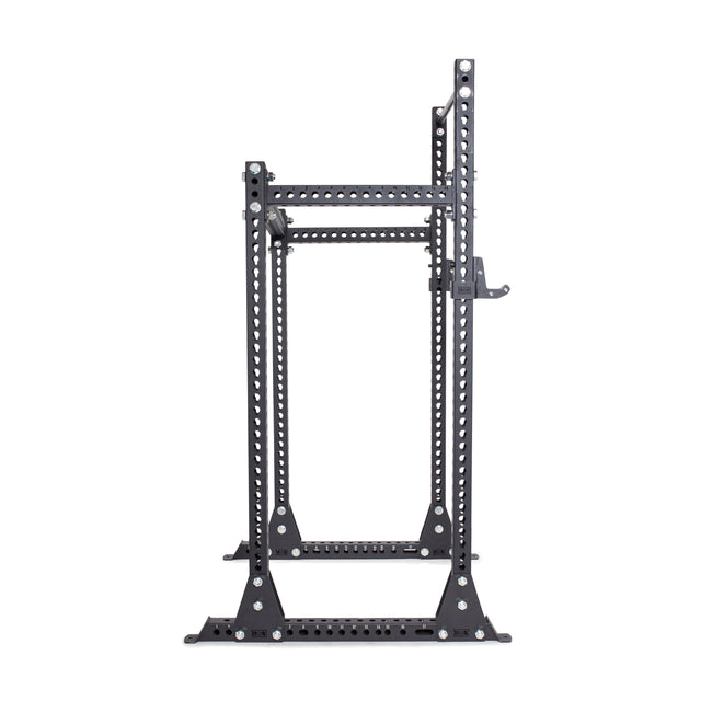 The Bells of Steel Manticore Half Rack Builder (3" x 3", 1" Holes) is a black metal rack with adjustable hooks and multiple holes for customizable weightlifting and strength training in your home gym, shown on a white background.