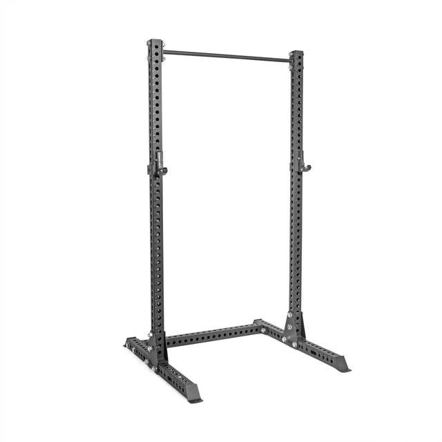 The Bells of Steel Manticore Squat Stand - Prebuilt (3" x 3", 1" Holes) features black metal construction, multiple adjustment holes, stabilizing base supports, and a pull-up bar—ideal for weightlifting and home gym strength training.