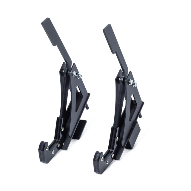 Two identical Bells of Steel Monolift Rack Attachments, black plastic brackets with angled supports and metal screws, are positioned upright on a white background—perfect for efficient bar adjustments and saving space in your gym.