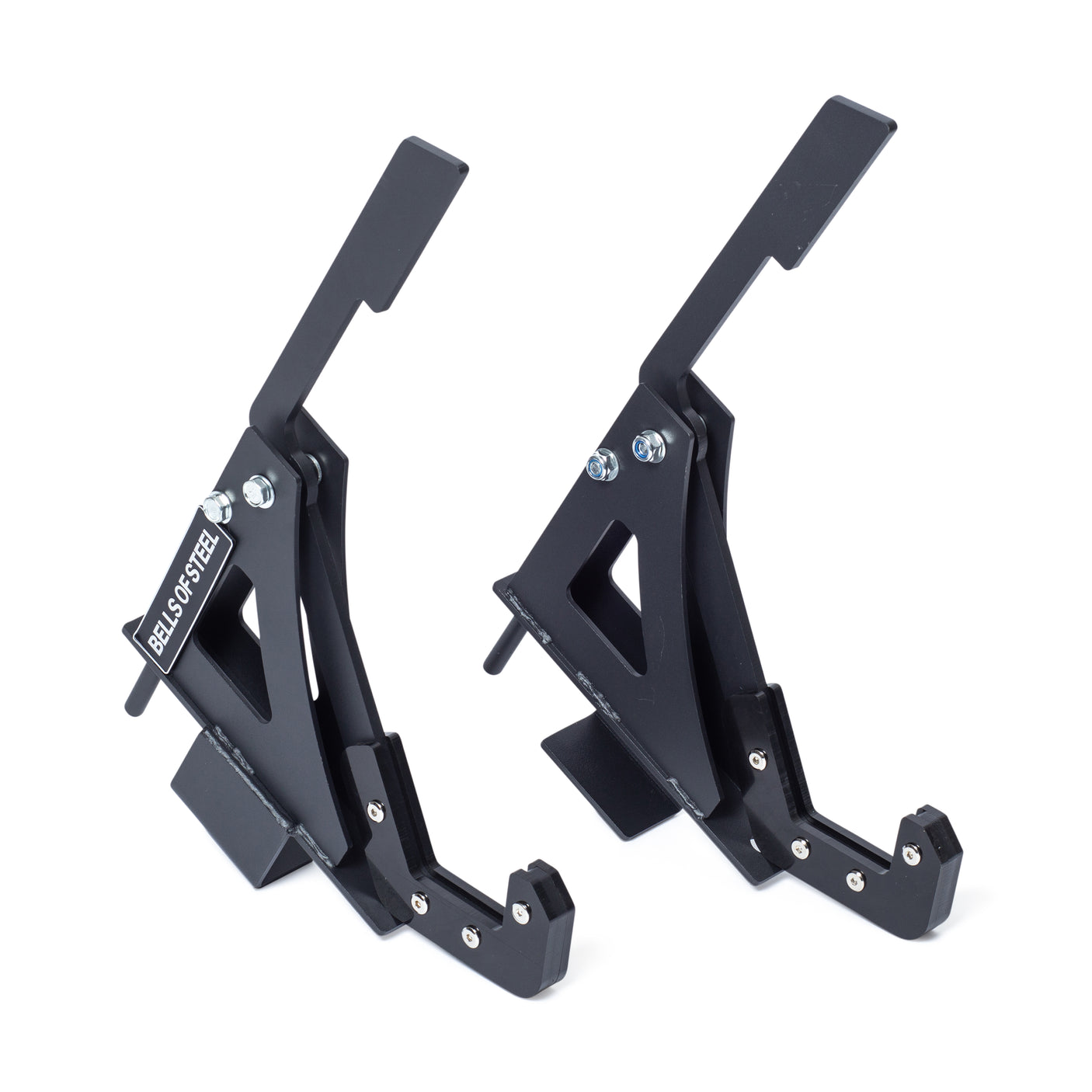 Two black Monolift Rack Attachments by Bells of Steel, featuring angled arms and bolts for secure bar adjustments and space-saving storage, stand side by side on a white background. One displays the “DEALS ON STEEL” label.