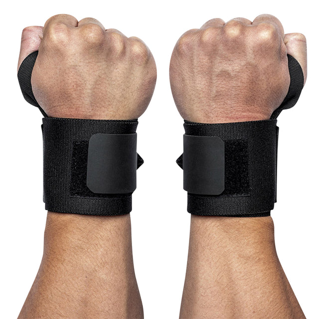 Two fists raised, each wrist secured with Bells of Steel’s Mighty Wrist Wraps—black wraps with Velcro straps, essential gear for fitness and powerlifting.