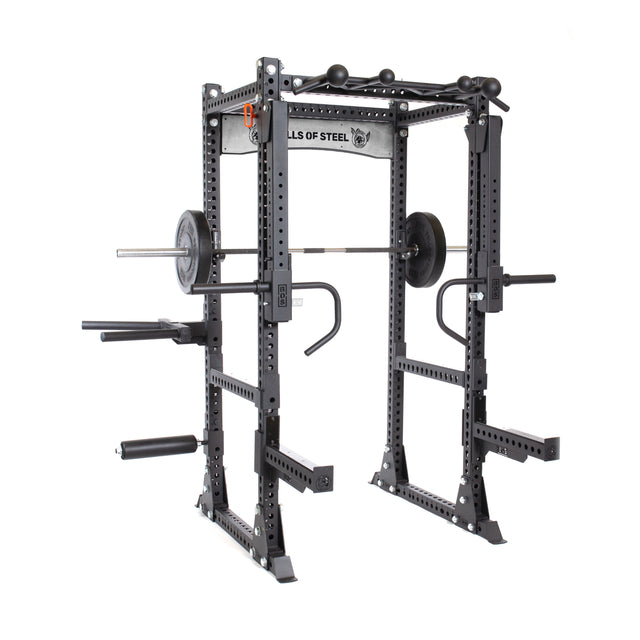 The Bells of Steel Manticore Flat Foot Power Rack (3"x3", 1" holes) comes prebuilt in black and includes a pull-up bar, dip bars, weight storage pegs, and a barbell set with plates for home strength training.