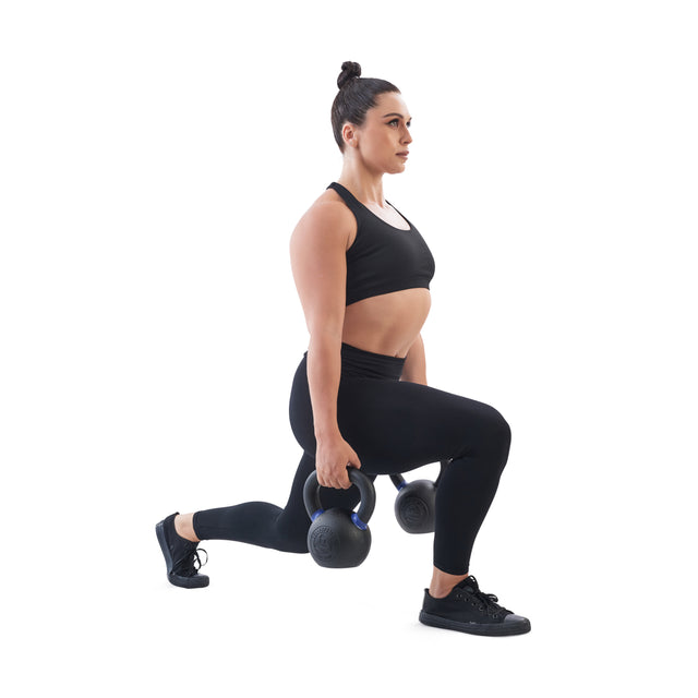 A woman in black athletic wear lunges while holding Bells of Steel Powder Coated Kettlebells, known for their rust-resistant finish and strong grip, against a plain white background.