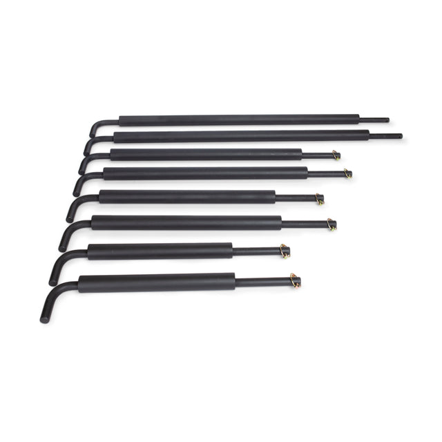 Seven black gas struts from Bells of Steel are arranged in a row on a white background, ideal for enhancing stability and protection when used with Pin Pipe Safeties.