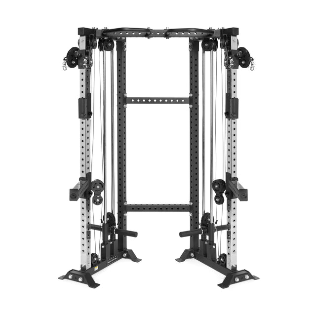The Bells of Steel Functional Trainer Cable Tower is a freestanding home gym machine, black and silver in color, featuring adjustable pulleys on both sides, a pull-up bar on top, and various strength training handles.