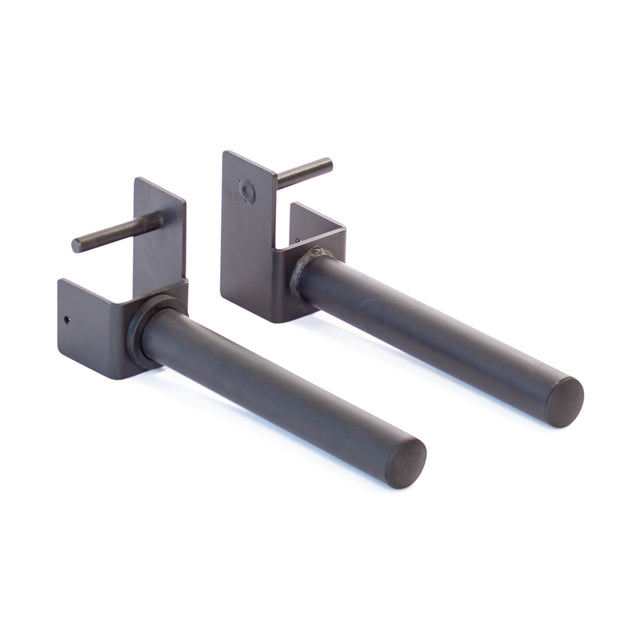 Two black metal Pin Plate Pegs by Bells of Steel, each with a horizontal cylindrical bar and mounting pins, designed as durable power rack accessories to securely hold weightlifting bars.