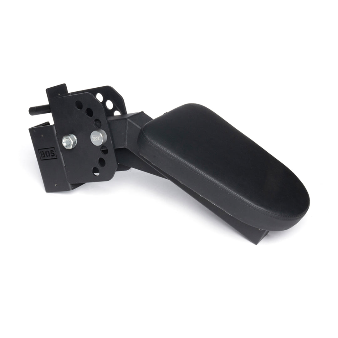 The Bells of Steel Seal Row Pad Rack Attachment is a black adjustable armrest with a mounting bracket, multiple customization holes, and a padded top for comfort, ideal as a chest support rack accessory and shown against a white background.