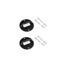 Two black circular metal wall mounts—the Human Trainer - Ceiling Mounts by Bells of Steel USA—are displayed, each crafted as a dependable fixed anchor for your resistance band system or as a secure ceiling mount. Each mount is accompanied by four screws, washers, and wall plugs, all neatly arranged on a white background.