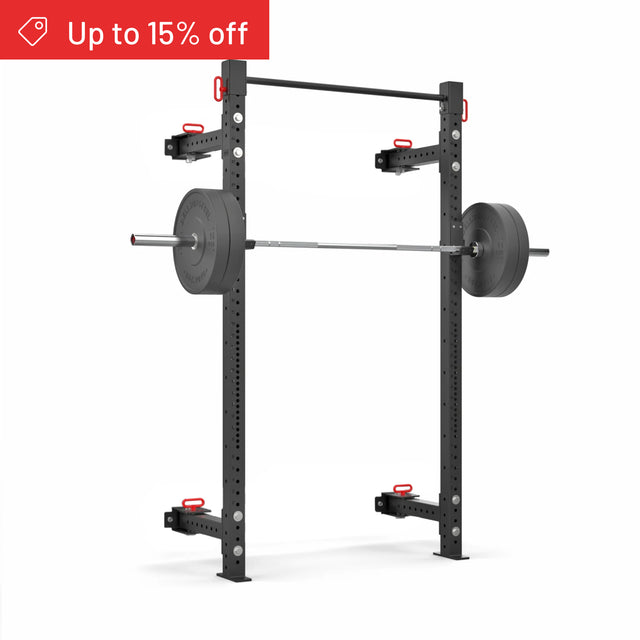 The Bells of Steel Roc Foldable 2 Post Cage Builder (3"x3", ⅝" holes) in black, shown with an Olympic barbell and plates on a white background. Ideal for home gyms. A red banner at the top left says “Up to 15% off.”.