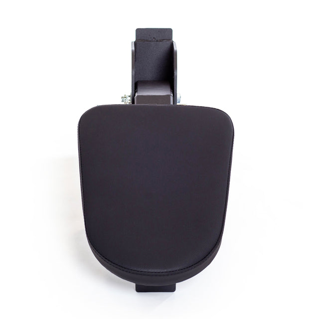 A Bells of Steel Seal Row Pad Rack Attachment, black and rectangular with a padded surface and sturdy base, is shown from above against a white background.