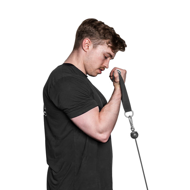A man with brown hair and a mustache performs a bicep curl using Bells of Steel USA's Aluminum Handles Pair with Bearings. Wearing a black shirt, he focuses on his form as the sleek built-in bearings ensure smooth movement against the plain white background.