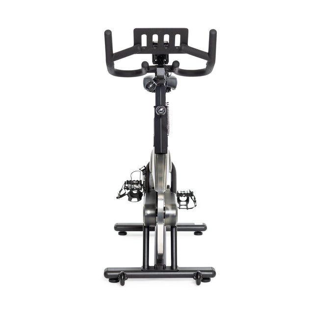 Front view of the Bells of Steel Blitz Indoor Cycling Bike with adjustable handlebars, digital display, and pedal straps. Set against a white background, it provides smooth magnetic resistance for an enhanced workout.