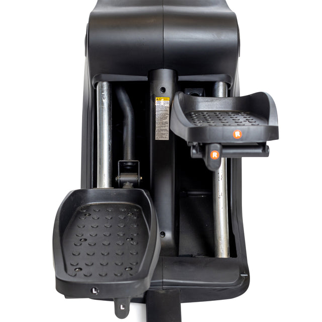 Close-up of the Bells of Steel Blitz Stepper’s black foot pedals, labeled "L" and "R," featuring textured grip and sturdy metal bars—perfect for low-impact cardio workouts.