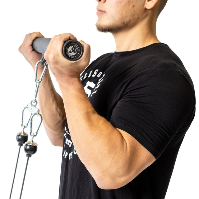 A person in a black t-shirt does a bicep curl on a cable machine using the Bells of Steel Fat Bar - Straight Handle Bar, improving grip strength, pictured from the side on a white background.