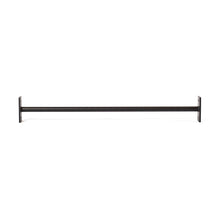 The Bells of Steel Straight Pull Up Bar, featuring a black metal finish and rectangular wall mounts on each end, echoes the robust style of power rack designs and is shown against a white background.