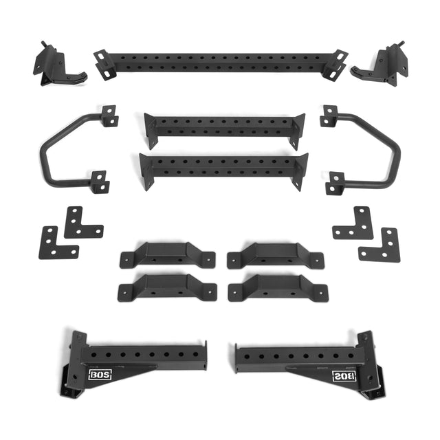 A set of black metallic components from the Bells of Steel Functional Trainer Cable Tower is laid out on a white background, featuring bars with holes, brackets, and angular pieces. Some parts are labeled "506" and "206," suggesting their function in the assembly.