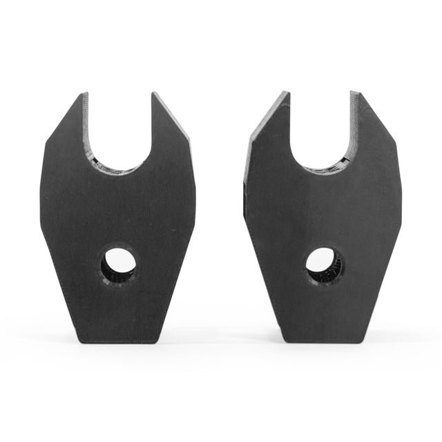 The Bells of Steel Above Rack Barbell Holder features two black metal dropouts with a U-shaped slot on top and a circular hole below, perfect for rack attachment or barbell storage. Displayed upright against a white background.