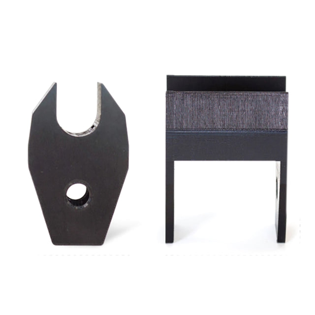 Two black metal parts from Bells of Steel are shown on a white background: the Above Rack Barbell Holder (right) features a rectangular top with two prongs, while the left piece has a U-shaped cutout and lower hole for rack attachment.