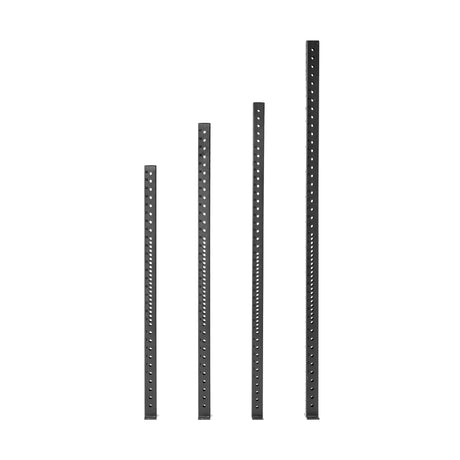 Four black Hydra Vertical Uprights by Bells of Steel are positioned side by side against a white background. Each upright features multiple evenly spaced holes along its length, perfect for accommodating rack attachments.