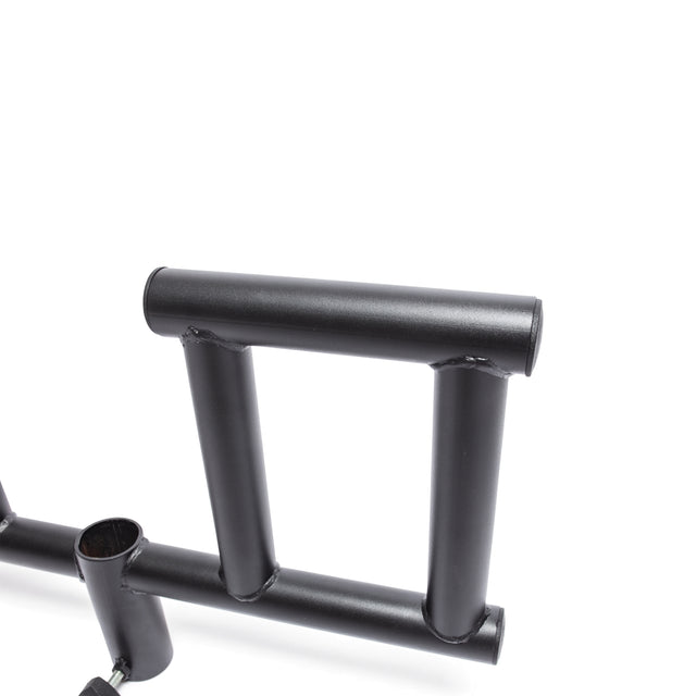 A close-up of the Bells of Steel Viking Press Attachment shows its black metal handle with a rectangular grip and cylindrical bars, photographed against a plain white background.