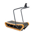 The Wooden Residential Manual Treadmill by Bells of Steel features a modern wood frame and black running surface. Its compact design includes an arched support bar and attached monitor, offering a stylish blend of functionality for minimalistic enthusiasts.