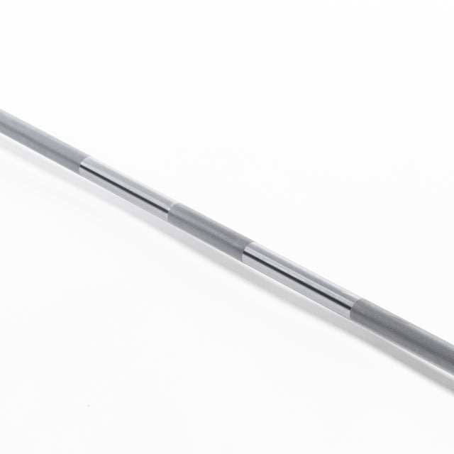 The Bells of Steel Oly Lifting Needle Bearing Bar - Women's, with a smooth silver 25mm shaft and textured grip sections, lies diagonally on a white background.